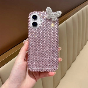 Detail of pink rhinestone iPhone case with a silver crystal butterfly and hand strap