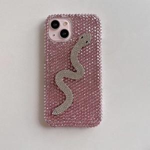 Detail of pink rhinestone iPhone case with a silver crystal snake design and luxury finish