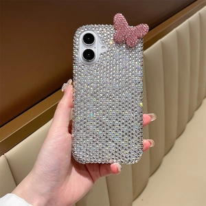 Close-up of sparkling silver rhinestones and pink 3D butterfly on iPhone case