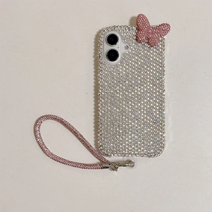Detail of luxury rhinestone phone case with pink 3D butterfly and matching wrist strap