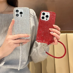 Sparkling rhinestone iPhone case with matching diamond ring wrist strap for women