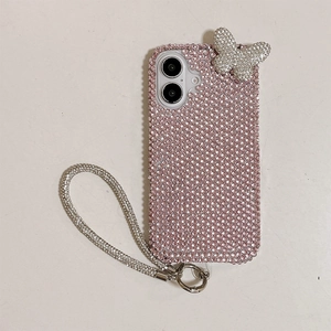 Close-up of pink rhinestone iPhone case with 3D silver butterfly and wrist strap