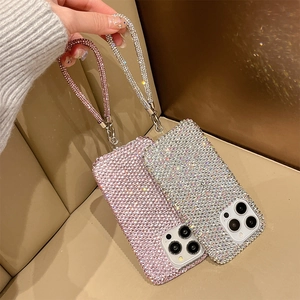 Sparkling full rhinestone iPhone case with matching wrist strap in pink and silver