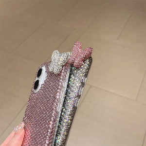 Detail of 3D crystal butterfly phone case with gradient pink and white rhinestones