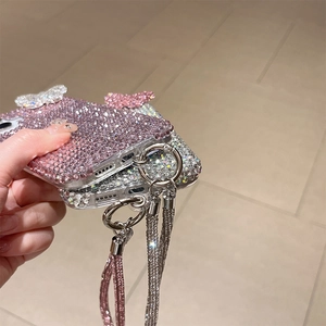 Detailed view of luxury rhinestone phone cases with 3D butterfly and crystal wrist strap