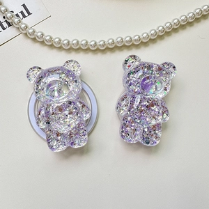 Macro detail of 3D bear phone socket with glitter sequins and purple resin filling