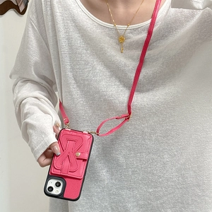 Hot pink lychee leather crossbody case with bow card holder and adjustable strap