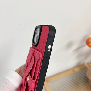 Detail shot of red lychee texture leather phone case with card slot and black frame