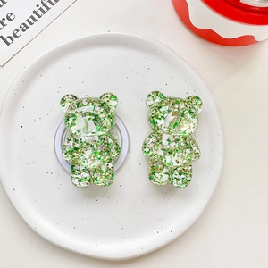 Detail view of green glitter bear phone sockets in a ceramic bowl, 2-piece set