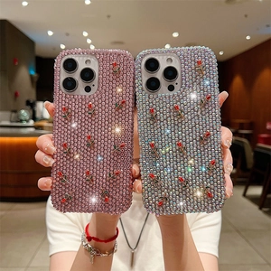 Luxury rhinestone iPhone case with 3D red rose accents in pink and silver finish