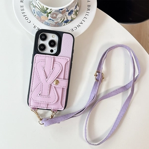 Close-up of lavender leather iPhone case with bow card holder and crossbody strap