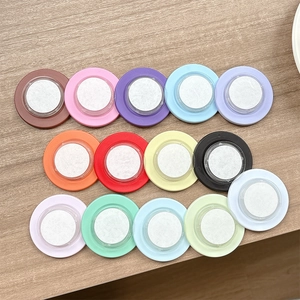 DIY colorful magnetic collapsible phone grip sockets in 14 vibrant colors on wood surface