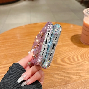 Detailed close-up of luxury rhinestone phone case in light purple and iridescent finish