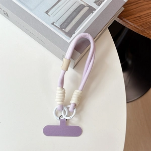 Close-up of lavender braided phone wrist strap with white adjuster and metal rings