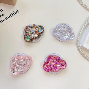 Detailed view of cloud-shaped phone sockets with colorful glitter and resin finish
