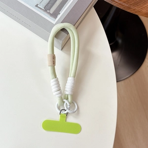 Thick light green woven phone wrist strap with white spring buckle and T-shaped insert pad