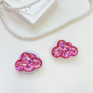 Detailed view of cloud-shaped pink glitter phone socket with sparkling sequins and resin finish