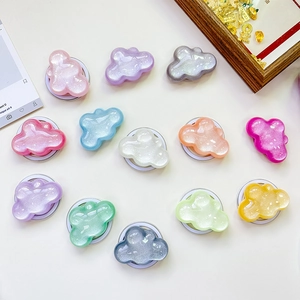 Glitter cloud phone socket grip holder in twelve pastel colors on white background