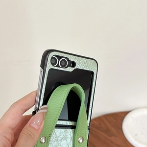 Green textured leather phone case for Samsung Z Flip6 with portable wrist strap handle