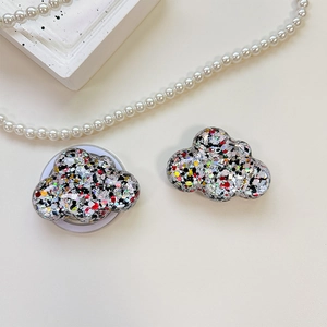 Detail of sequined cloud phone grip with retractable stand and colorful resin glitter