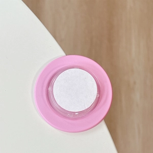 Pink magnetic phone socket detail showing circular adhesive layer and matte texture