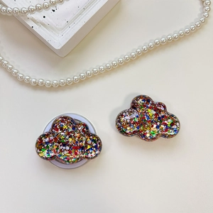 Close-up of cloud-shaped phone socket grip with colorful sequins and glitter filler