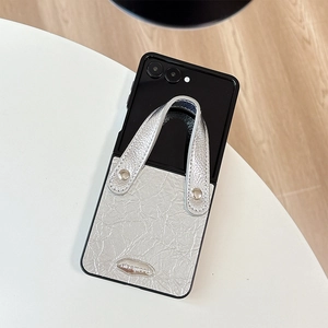 Detail of silver wrinkled leather phone case with metallic handle for Samsung Z Flip