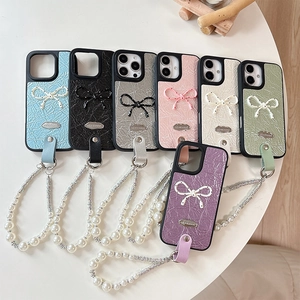 Fashionable iPhone case with bow decoration, pearl wrist strap, and pleated leather finish