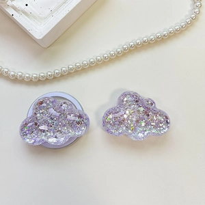Macro shot of purple sequin cloud phone grip with retractable socket base and glitter