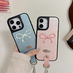 Blue and pink pleated leather iPhone cases with polka dot bows and pearl chain straps