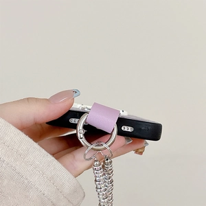 Detail of purple leather connector and faceted beaded strap on a black phone case