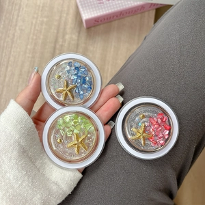 Handheld ocean themed phone grips with colorful stones, starfish and seashell designs