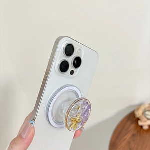 Detail of magnetic ocean-themed phone grip with starfish and purple stone chips