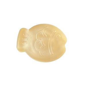 Fish-shaped resin massage tool in translucent yellow with smooth polished edges