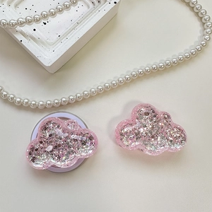 Close-up of cloud-shaped phone grip with sparkling pink sequins and laser glitter