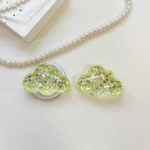 Detail of cloud-shaped phone socket with colorful sequins and glitter filling