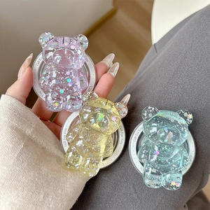 Close-up of bear-shaped phone grips with glitter sequins and Gift For You text details