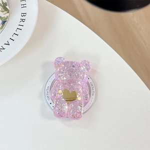 Vue détaillée du support téléphone ours à paillettes roses avec un petit cœur doré