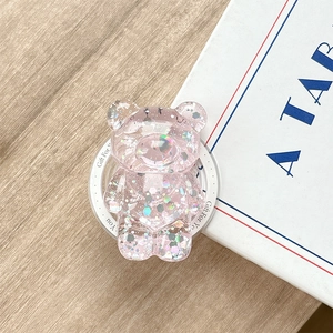Close-up of a pink bear phone grip with sparkling laser sequins and Gift For You base