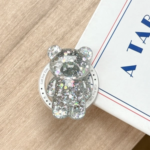 Macro detail of bear phone grip with holographic silver sequins and Gift For You engraving