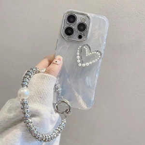 Detail of pearl heart phone case for iPhone with large beaded wristlet lanyard strap