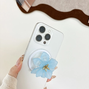 Support de téléphone fleur bleu clair en acrylique avec centre doré sur iPhone