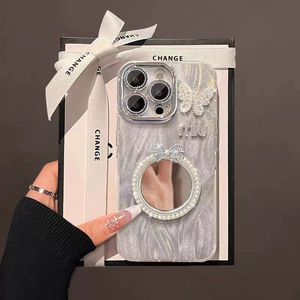 Sparkly iPhone case with mirror, butterfly charm, and pearl strap in luxury gift box