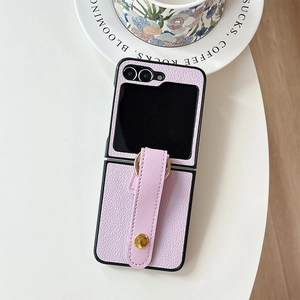 Detail view of purple leather case with hand strap and gold ring for Galaxy Z Flip 6