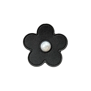 Elegant black leather flower phone socket with center pearl and detailed stitching
