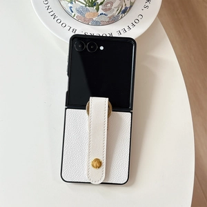 Macro shot of Z Flip leather phone case with white lychee texture and gold ring grip