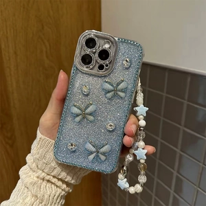 Blue glitter iPhone case with 3D butterflies, rhinestones and a beaded wrist strap