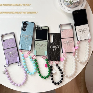 Custodia pieghevole in pelle con fiocco di strass e cinturino di perline per Samsung Z Flip