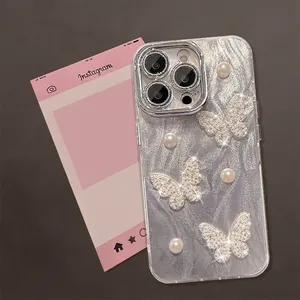 Macro shot of silver butterfly and pearl decorations on iPhone case with lens protection