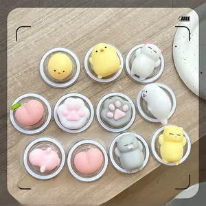Flat lay of diverse squishy cartoon phone grip accessories in various animal shapes